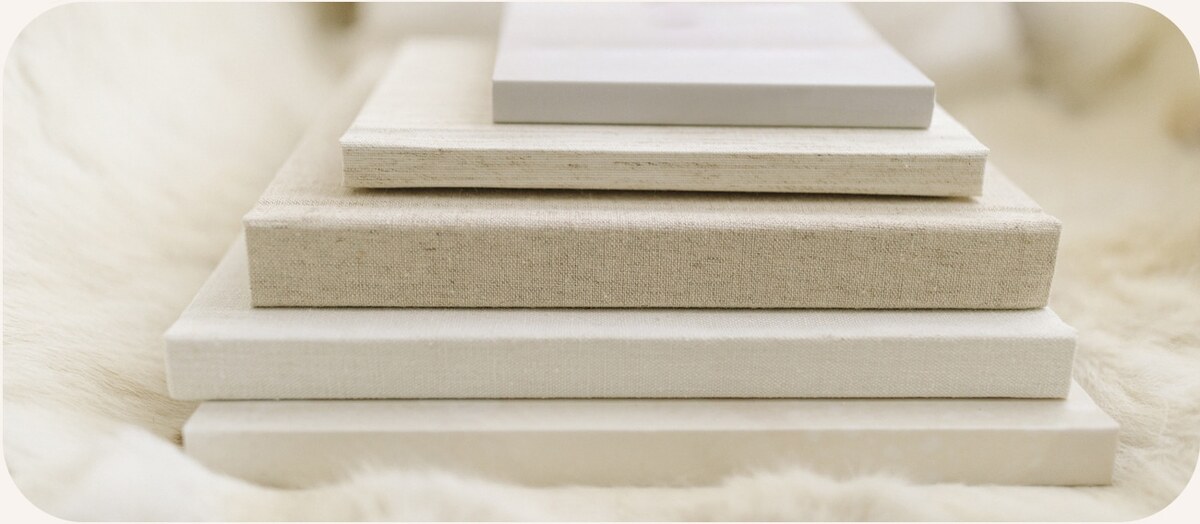 A stack of linen covered photo albums