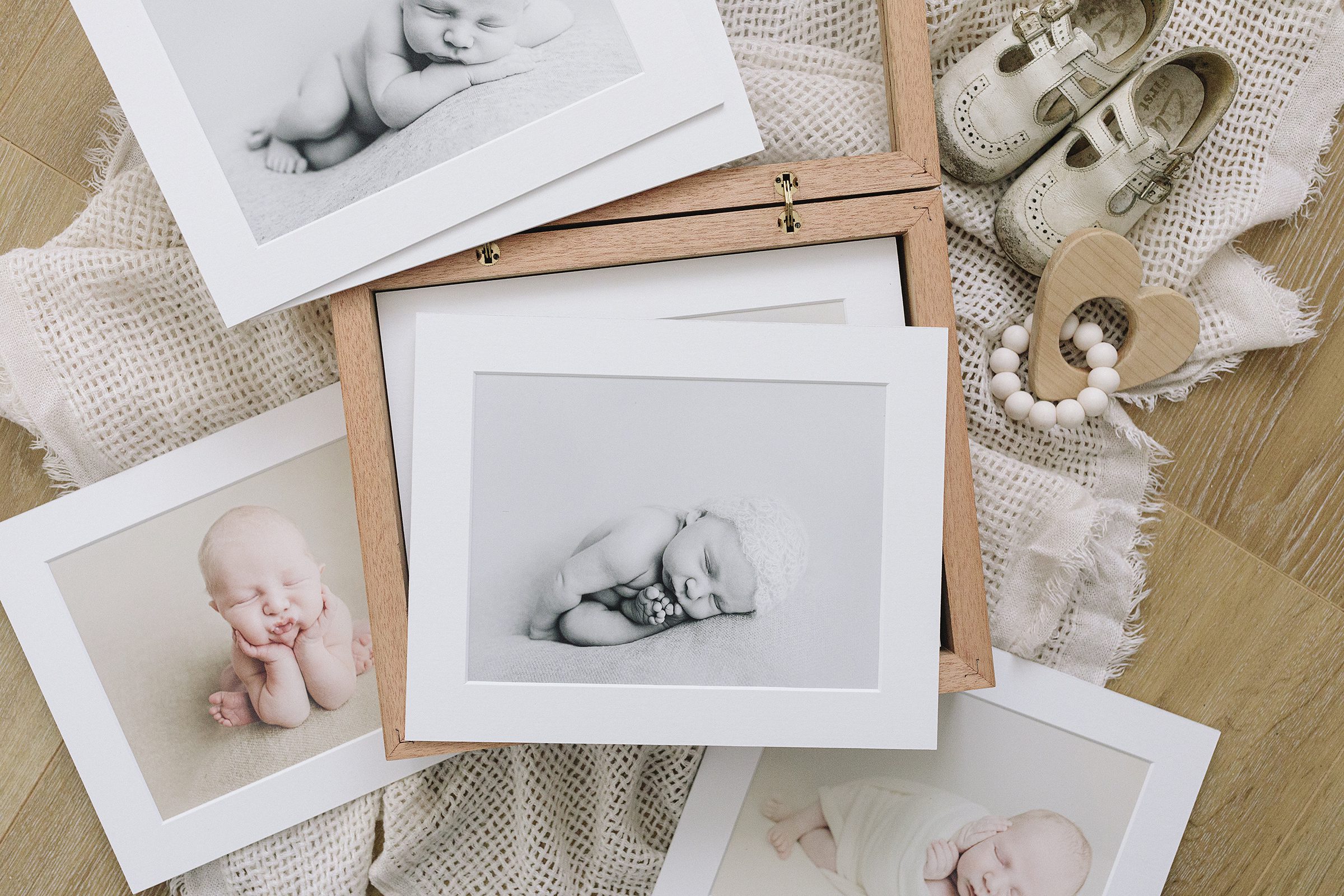 Wooden photo box with acrylic front showing mounted newborn photo