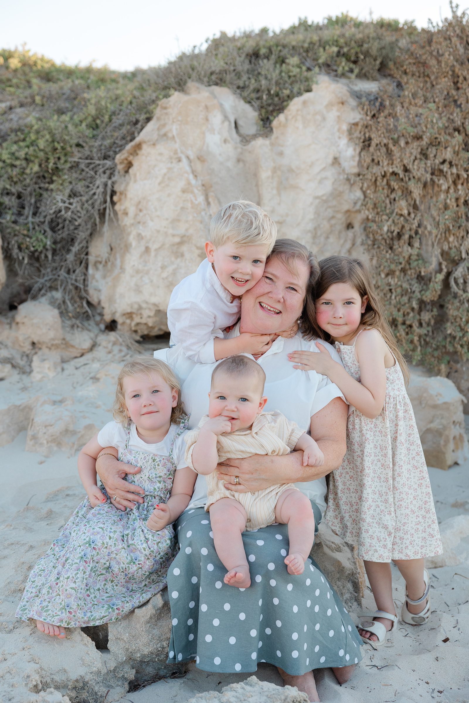 Grandparents with young grandchildren sharing a happy moment during a Perth family shoot
