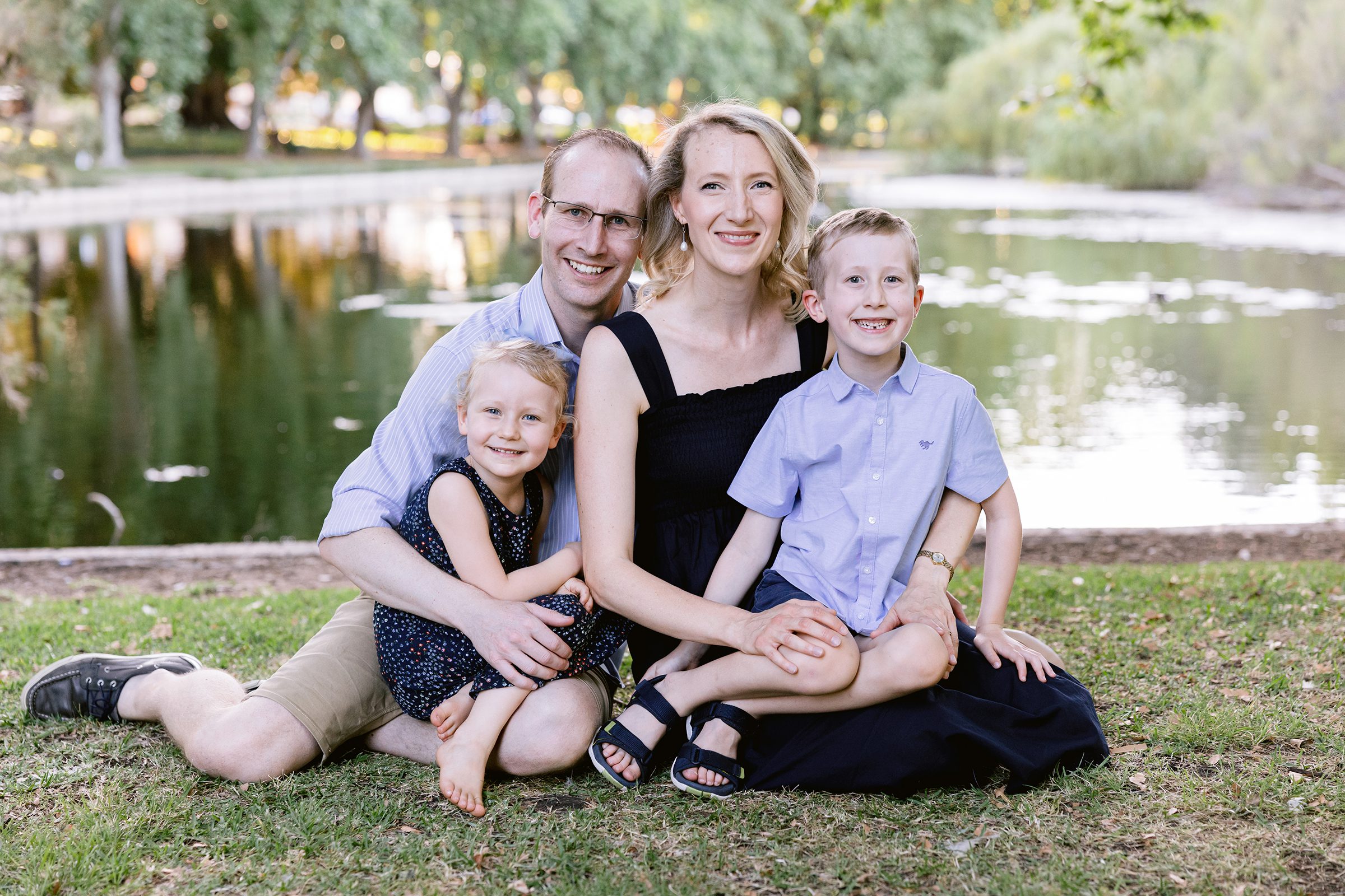 Small family unit posing for portraits during an extended family holiday session in Perth
