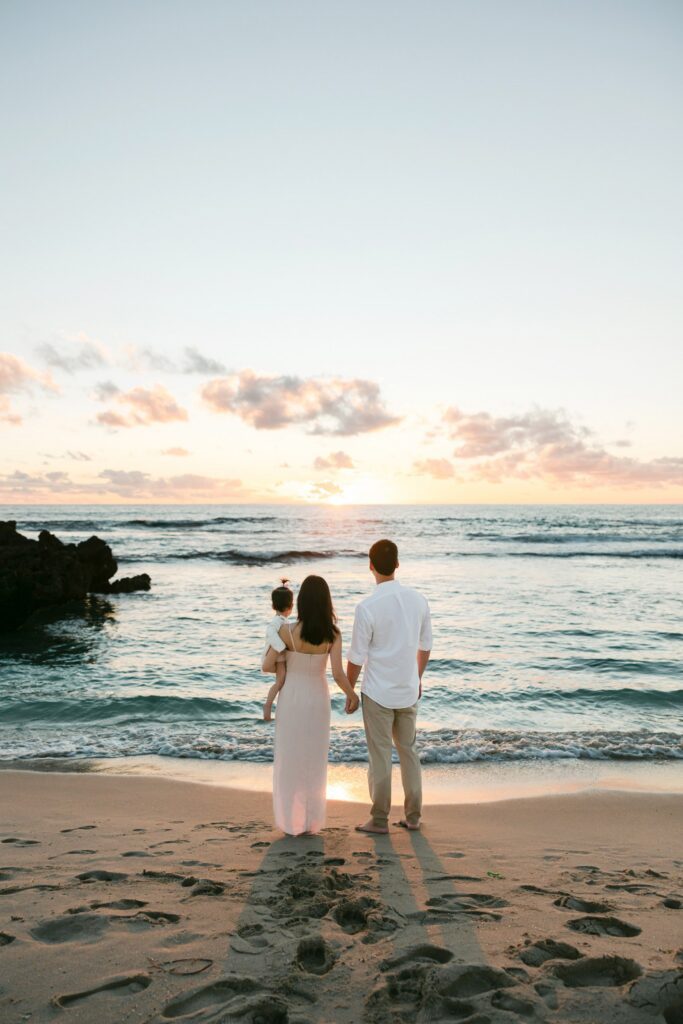 Perth family photography session at golden hour with warm sunset light reflecting on the water