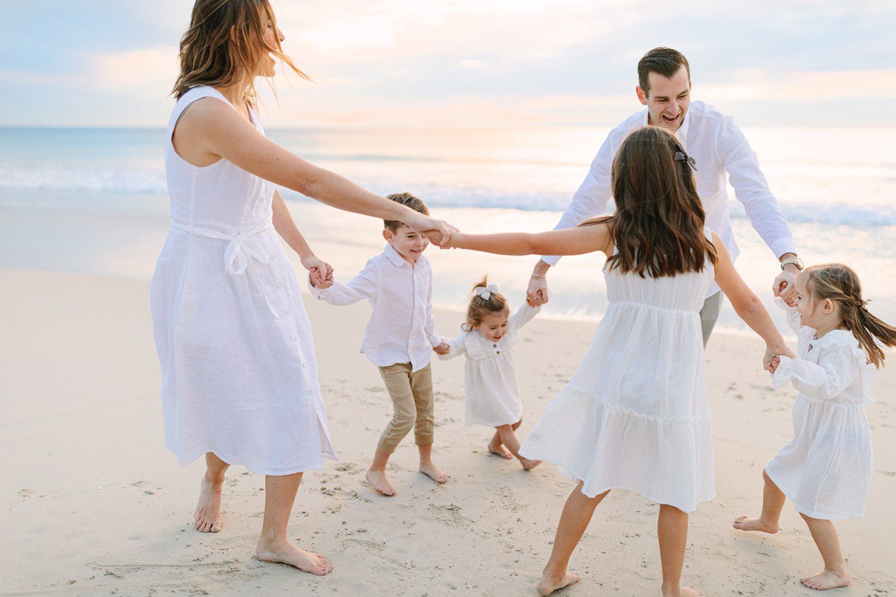 Candid play-based family portrait at sunset, Perth outdoor family photographer
