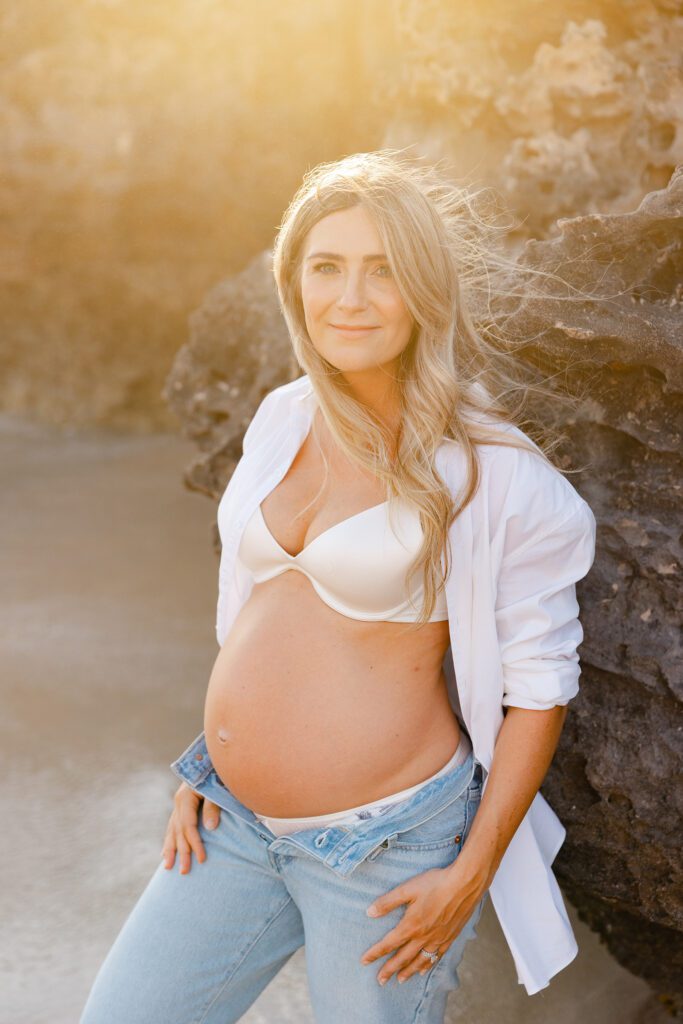 Perth maternity photographer captures expectant mother at golden hour in natural outdoor setting