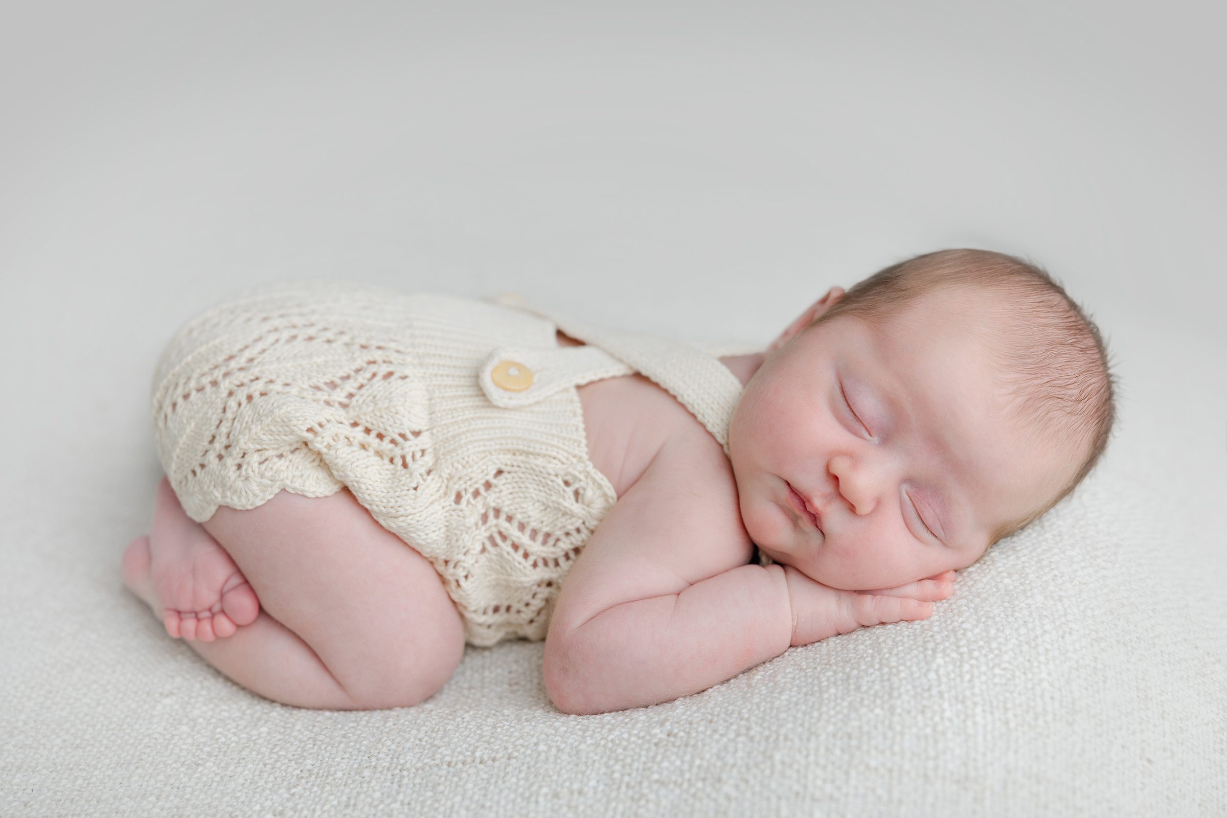 Perth newborn photographer documents sleeping newborn in fine art studio session