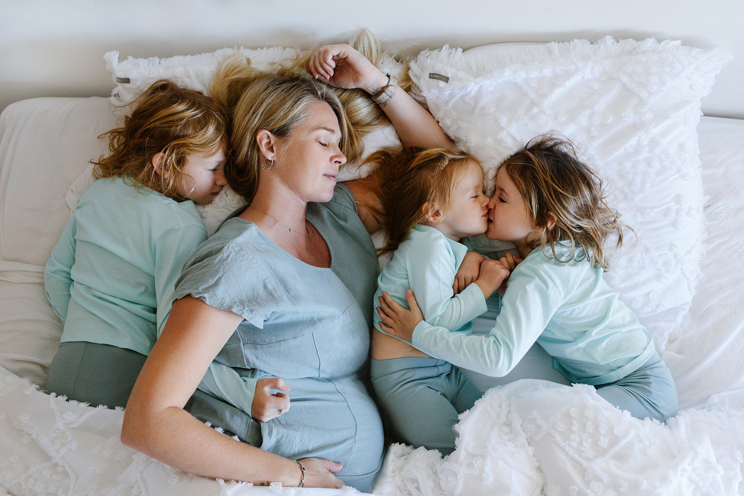 Perth maternity photographer capturing candid family moments at home.